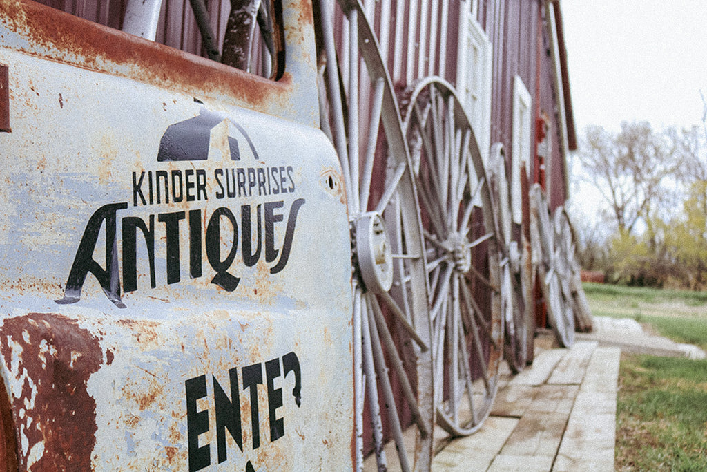 Side of the barn with Kinder Surprises Antiques sign